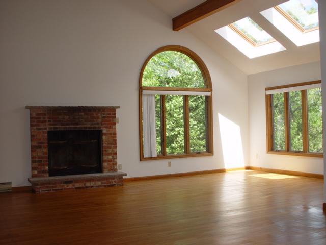 7204 High Knob Court Long Pond, PA 18334 - Photo 9 of 14 an empty room with wooden floor windows and a fireplace