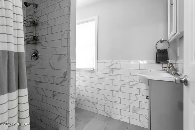 a bathroom with a sink and a shower