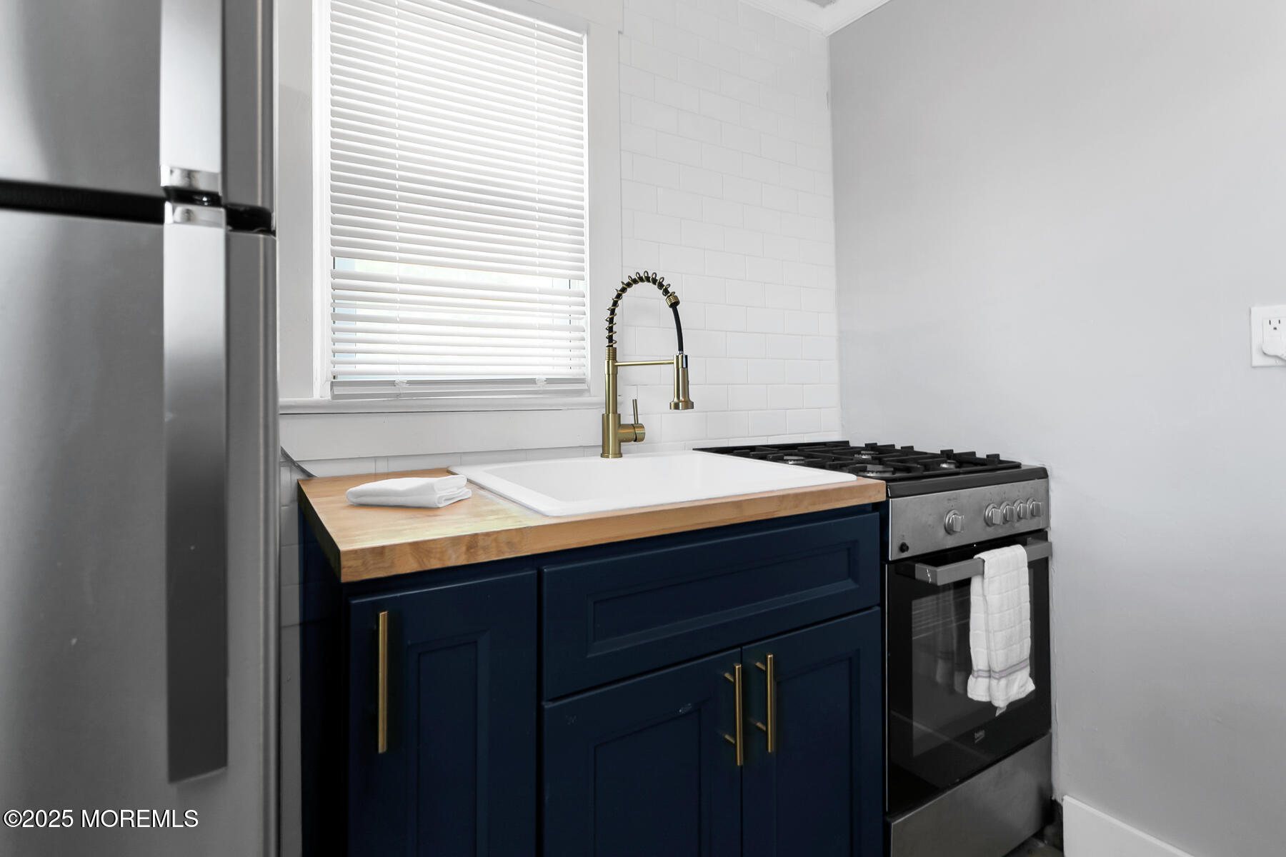 247 Sherman Avenue Seaside Heights, NJ 08751 - Photo 33 of 42 a sink sitting next to a window