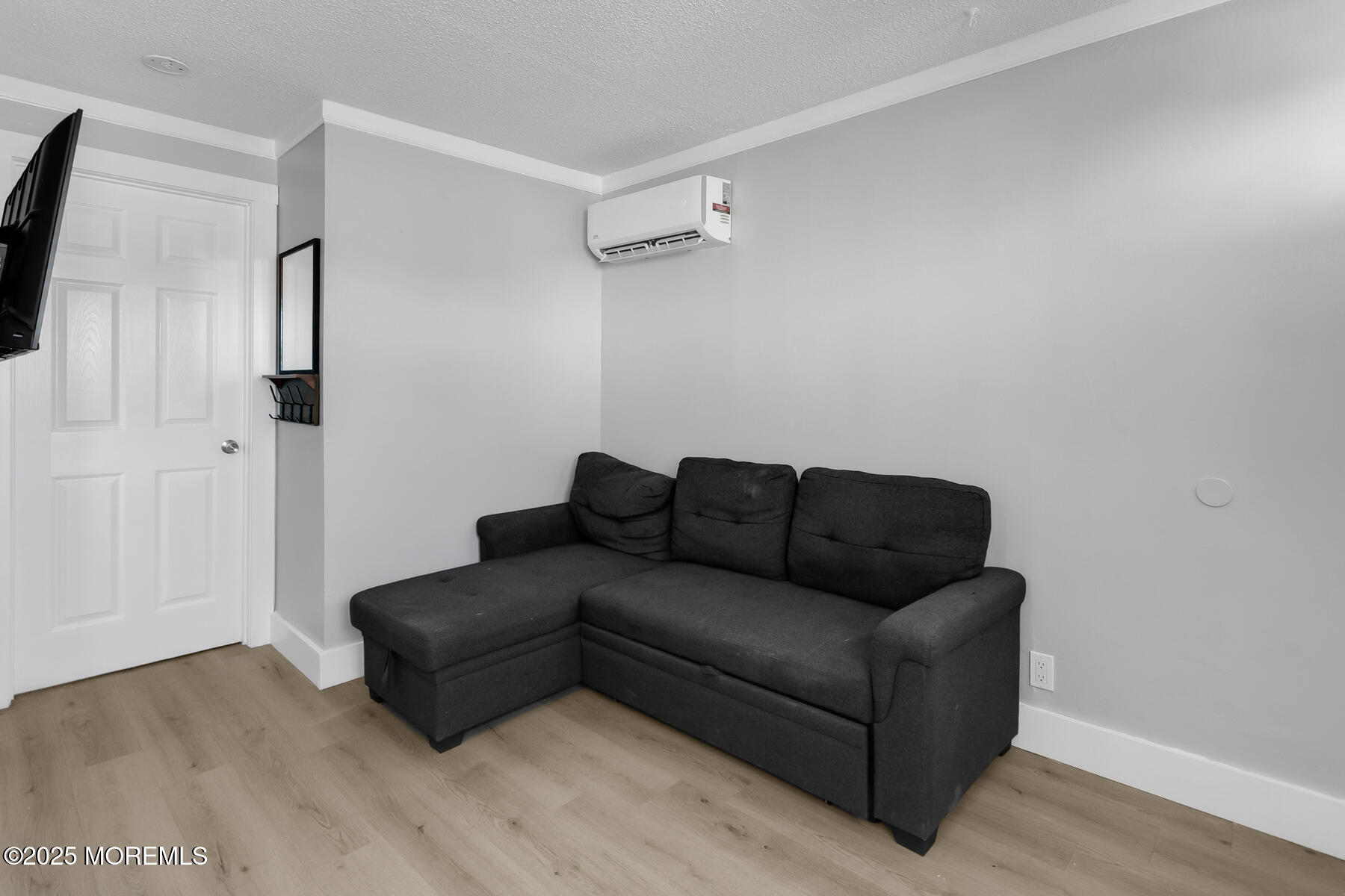 247 Sherman Avenue Seaside Heights, NJ 08751 - Photo 34 of 42 a living room with furniture and a wooden floor
