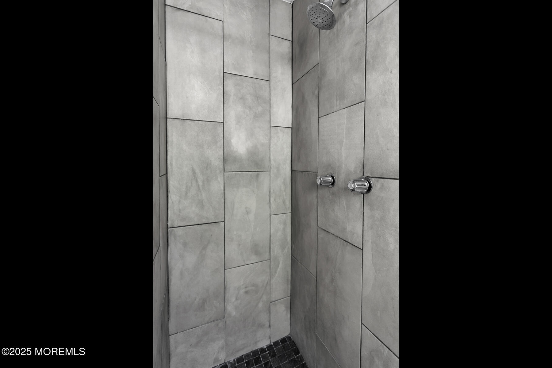 247 Sherman Avenue Seaside Heights, NJ 08751 - Photo 36 of 42 a bathroom with a glass shower door