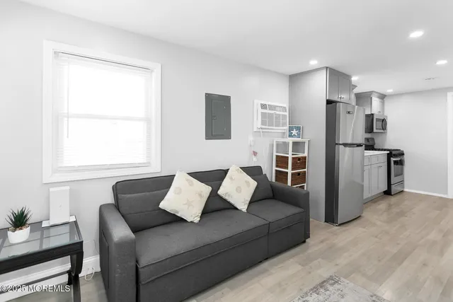 a living room with furniture and a window