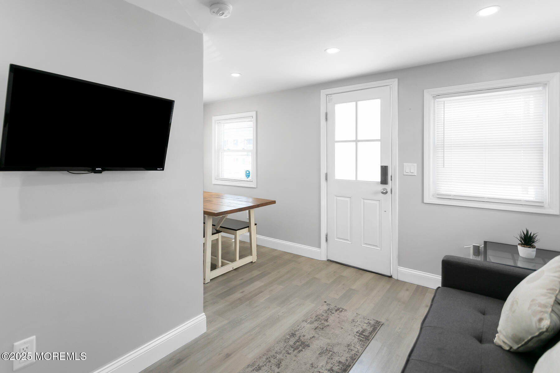 247 Sherman Avenue Seaside Heights, NJ 08751 - Photo 9 of 42 a living room with furniture and a flat screen tv