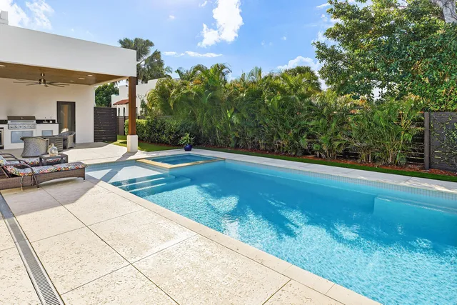a view of a swimming pool with seating area