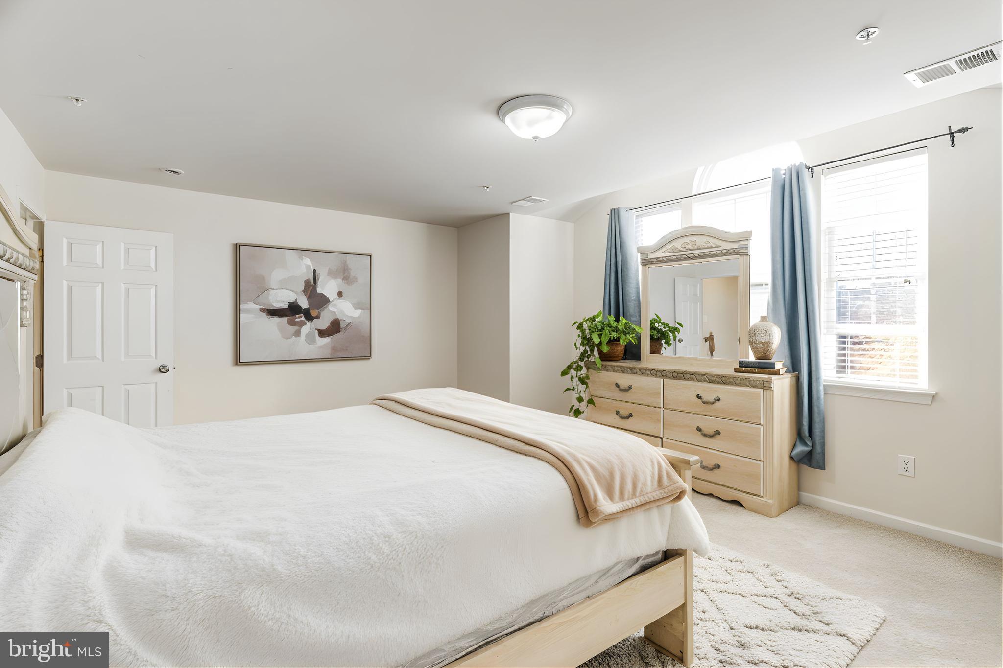 4615 Cimmaron Greenfields Drive Bowie, MD 20720 - Photo 16 of 27 a bedroom with a bed and a window