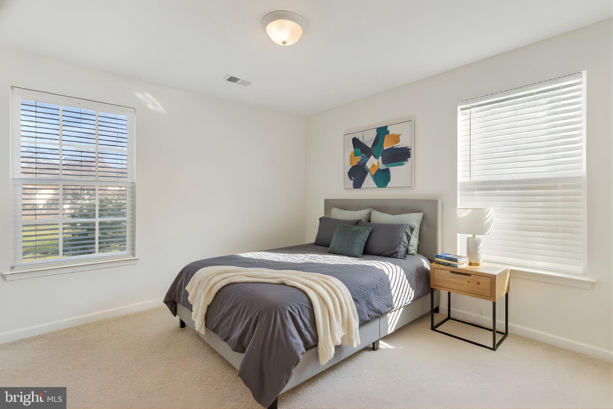 4615 Cimmaron Greenfields Drive Bowie, MD 20720 - Photo 17 of 27 a bedroom with a bed and a window