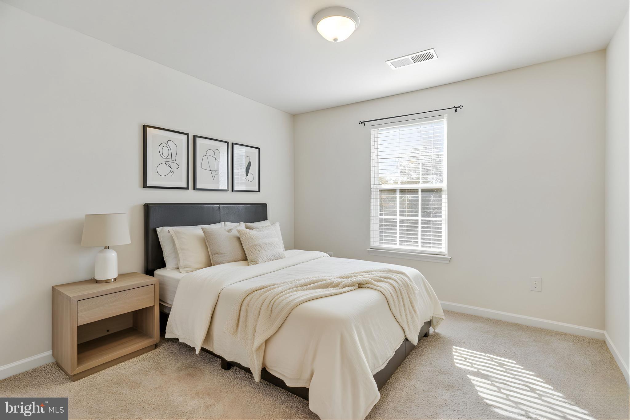 4615 Cimmaron Greenfields Drive Bowie, MD 20720 - Photo 18 of 27 a bedroom with a bed and a window