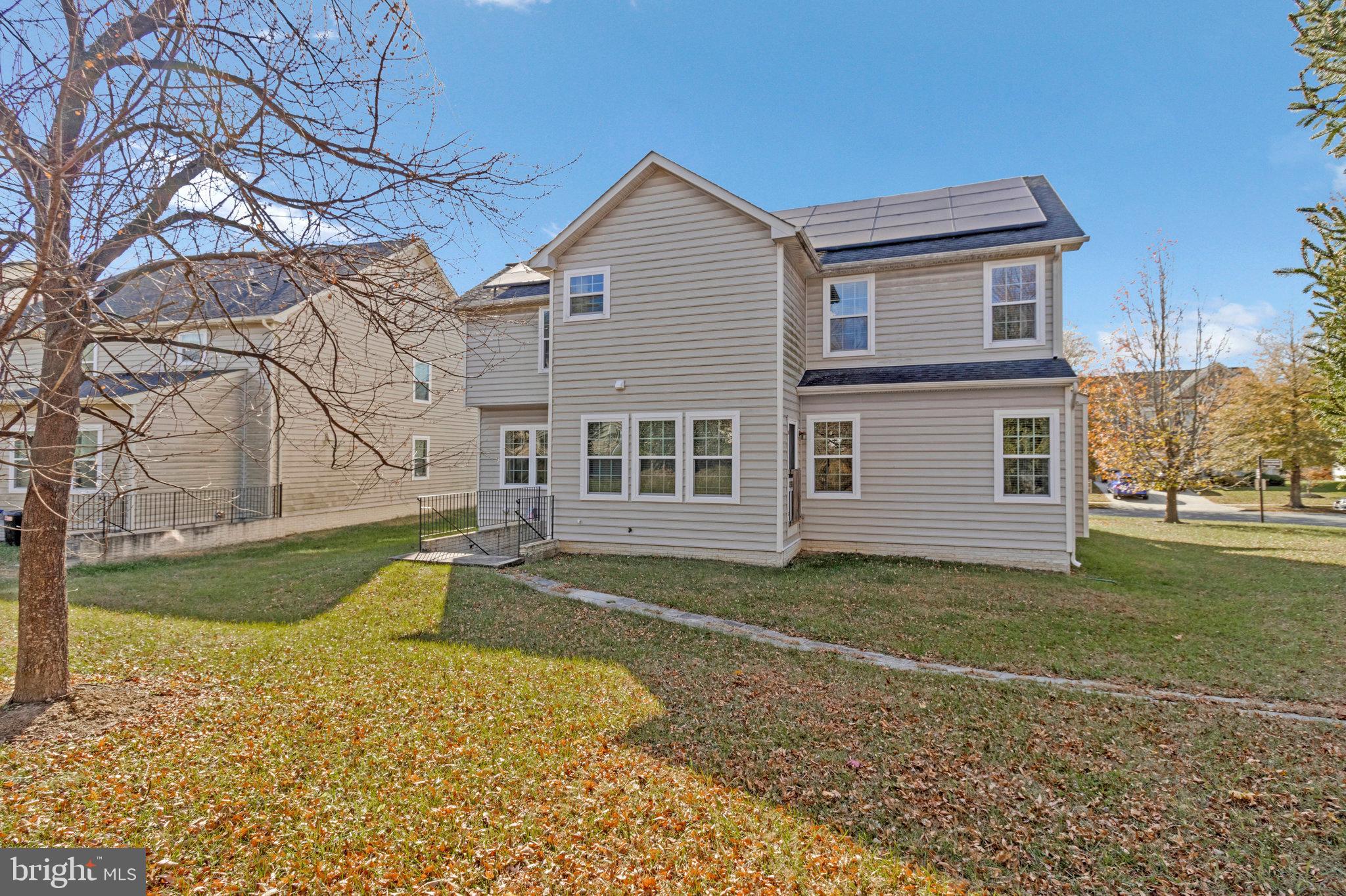 4615 Cimmaron Greenfields Drive Bowie, MD 20720 - Photo 26 of 27 a view of a house with a yard