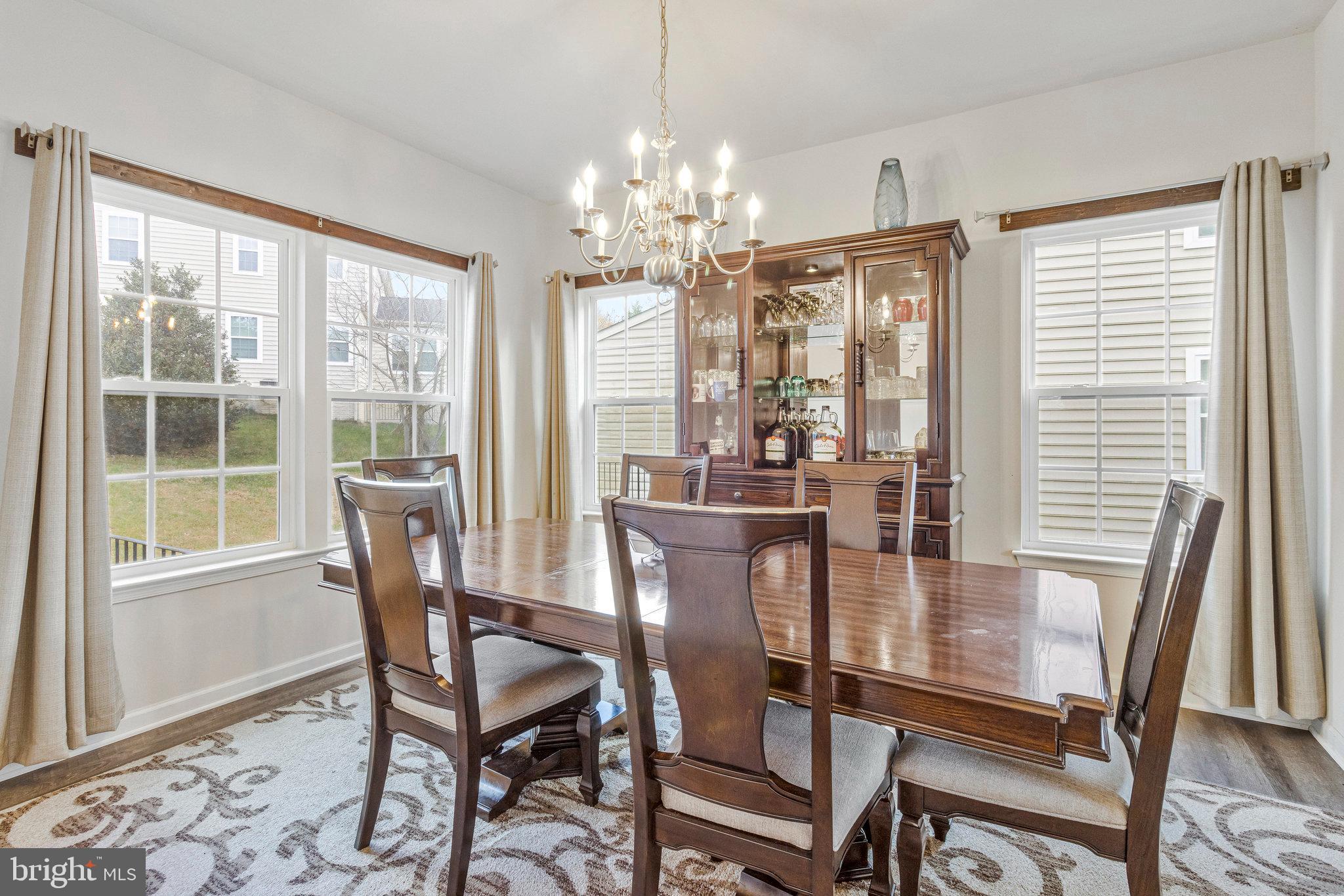 4615 Cimmaron Greenfields Drive Bowie, MD 20720 - Photo 4 of 27 a view of a dining room with furniture window and outside view