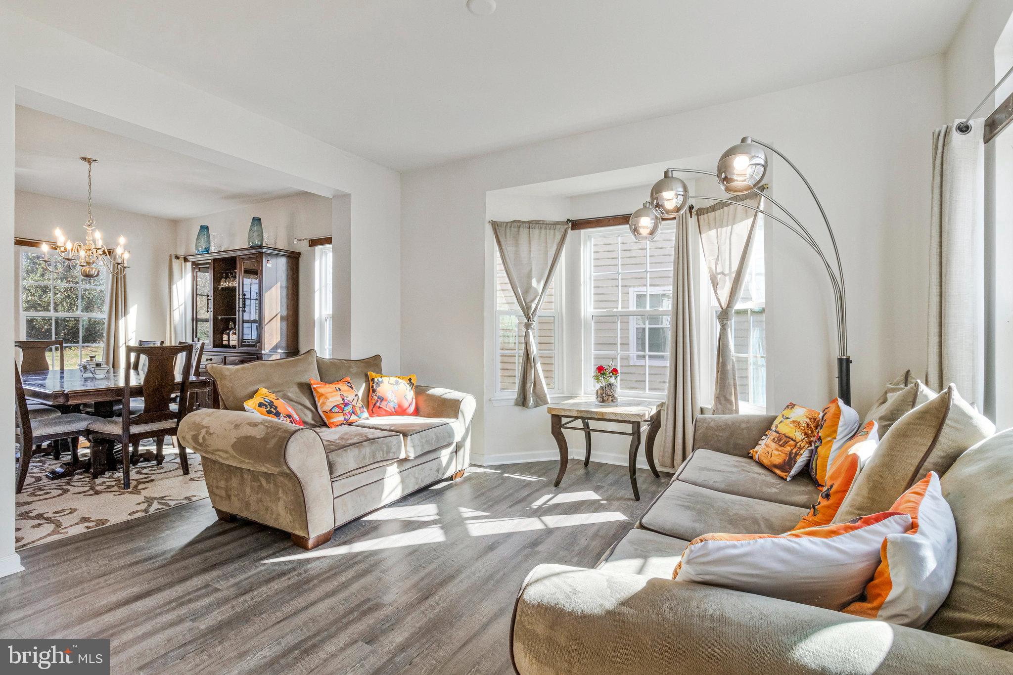 4615 Cimmaron Greenfields Drive Bowie, MD 20720 - Photo 6 of 27 a living room with furniture and a large window