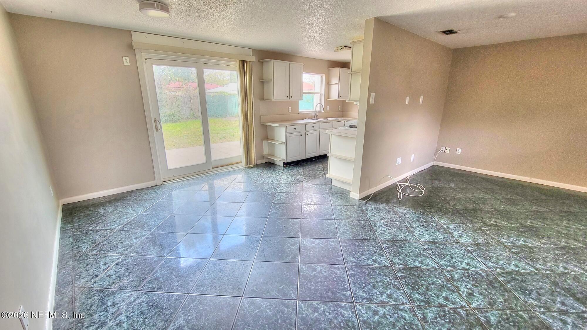 2472 Fernside Road Jacksonville, FL 32246 - Photo 6 of 16 a view of an empty room with a window