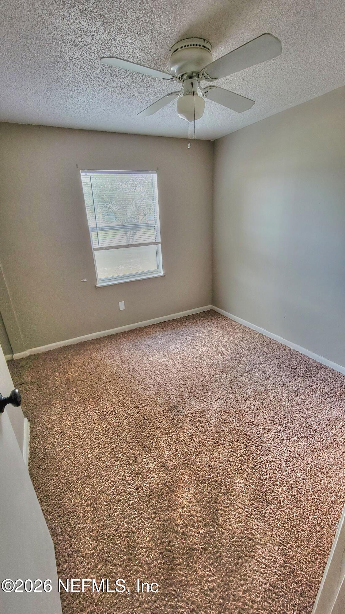 2472 Fernside Road Jacksonville, FL 32246 - Photo 9 of 16 a view of an empty room with a window