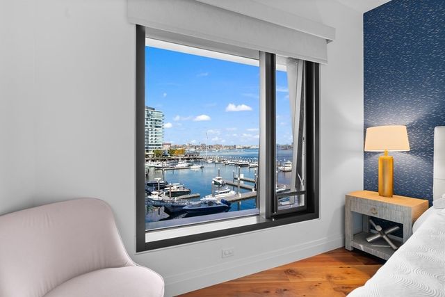 a living room with furniture and a lamp