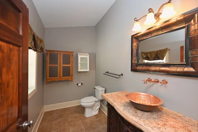 a view of a kitchen with stainless steel appliances granite countertop a stove top oven a sink dishwasher with wooden floor and cabinets