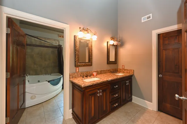 a view of a hallway with wooden floor and a large window
