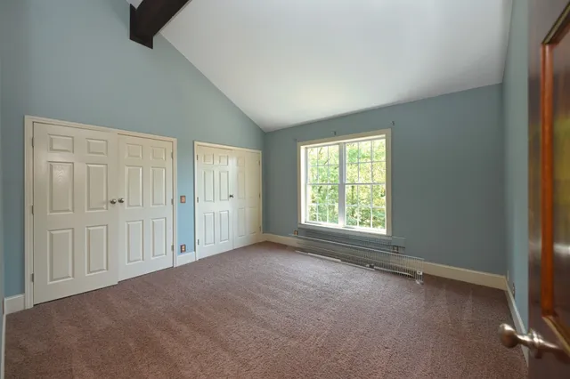 a kitchen with stainless steel appliances granite countertop a stove a sink dishwasher and a refrigerator with wooden floor