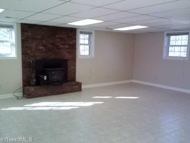 1105 Rogers Road Mount Airy, NC 27030 - Photo 6 of 8 Exterior Front. DEN ON LOWER LEVEL WITH FIREPLACE INSERT