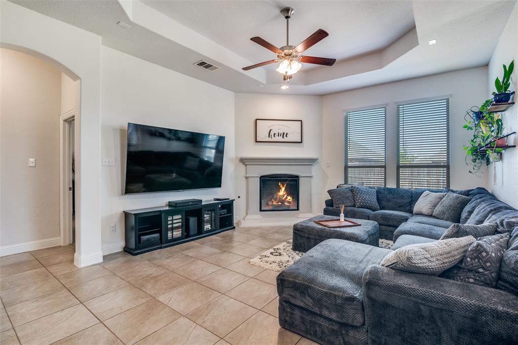 537 Declaration Way Fate, TX 75189 - Photo 11 of 39 a living room with furniture and a flat screen tv