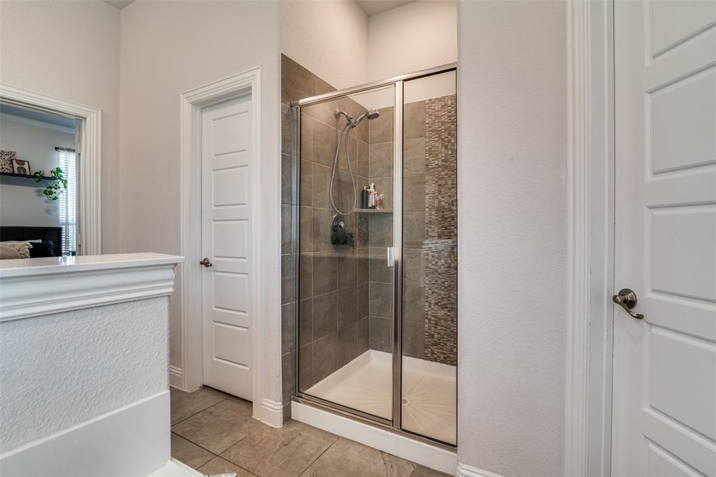 537 Declaration Way Fate, TX 75189 - Photo 17 of 39 a bathroom with a shower and a sink