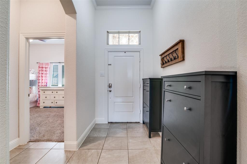 537 Declaration Way Fate, TX 75189 - Photo 18 of 39 a view of a closet area with mirror