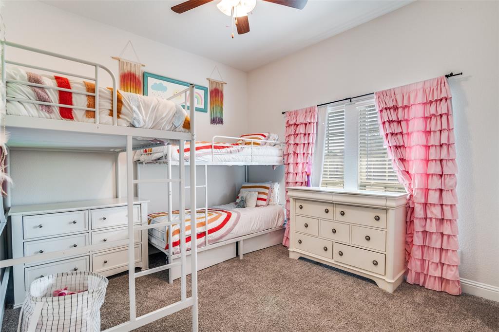 537 Declaration Way Fate, TX 75189 - Photo 19 of 39 a bedroom with furniture and a baby crib