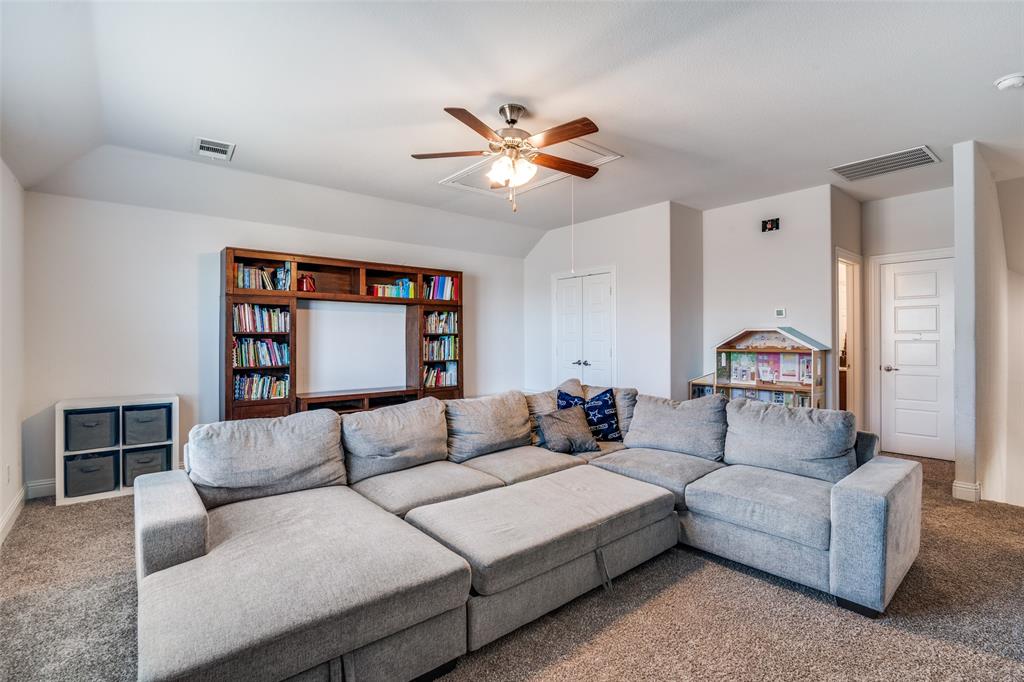 537 Declaration Way Fate, TX 75189 - Photo 31 of 39 a living room with furniture and a ceiling fan