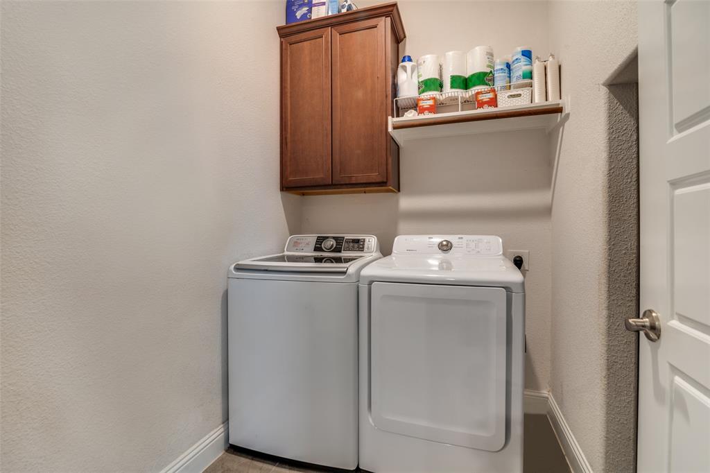 537 Declaration Way Fate, TX 75189 - Photo 33 of 39 a utility room with dryer and washer