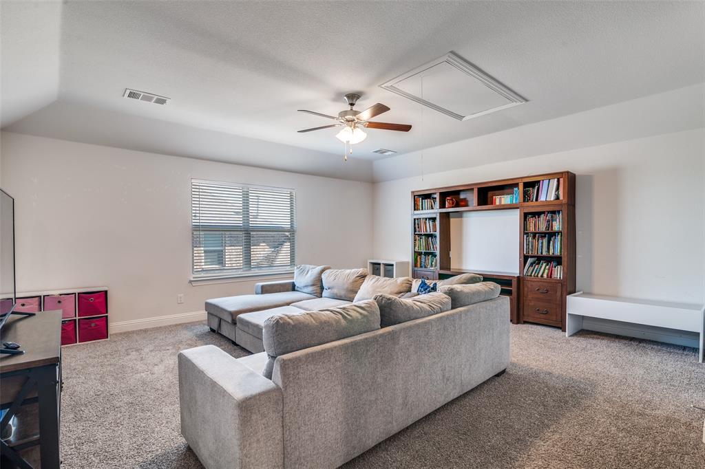 537 Declaration Way Fate, TX 75189 - Photo 4 of 39 a living room with furniture and a flat screen tv