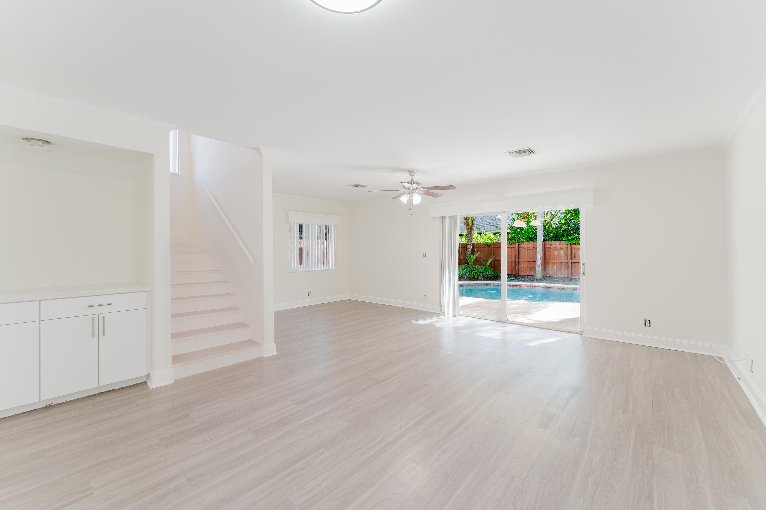 302 Northeast 36th Street Boca Raton, FL 33431 - Photo 15 of 40 wooden floor in an empty room with a window