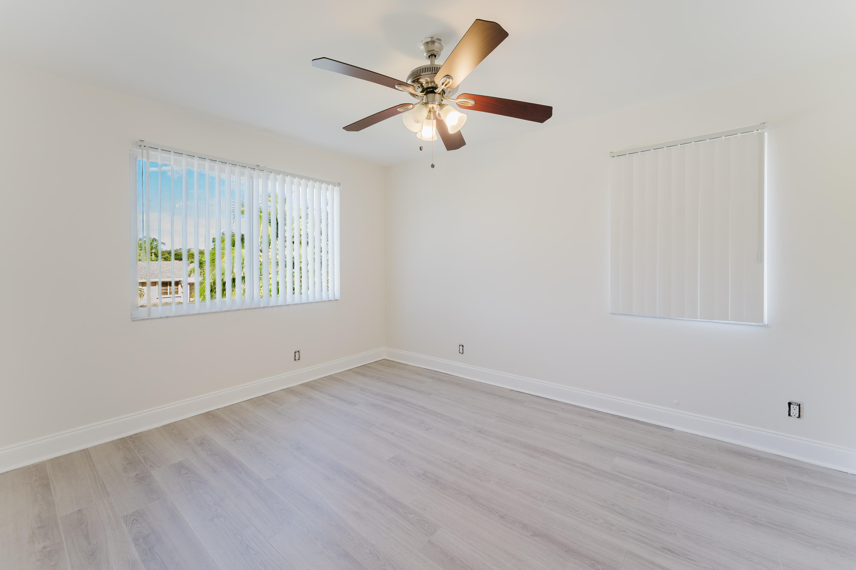 302 Northeast 36th Street Boca Raton, FL 33431 - Photo 20 of 40 an empty room with window and ceiling fan