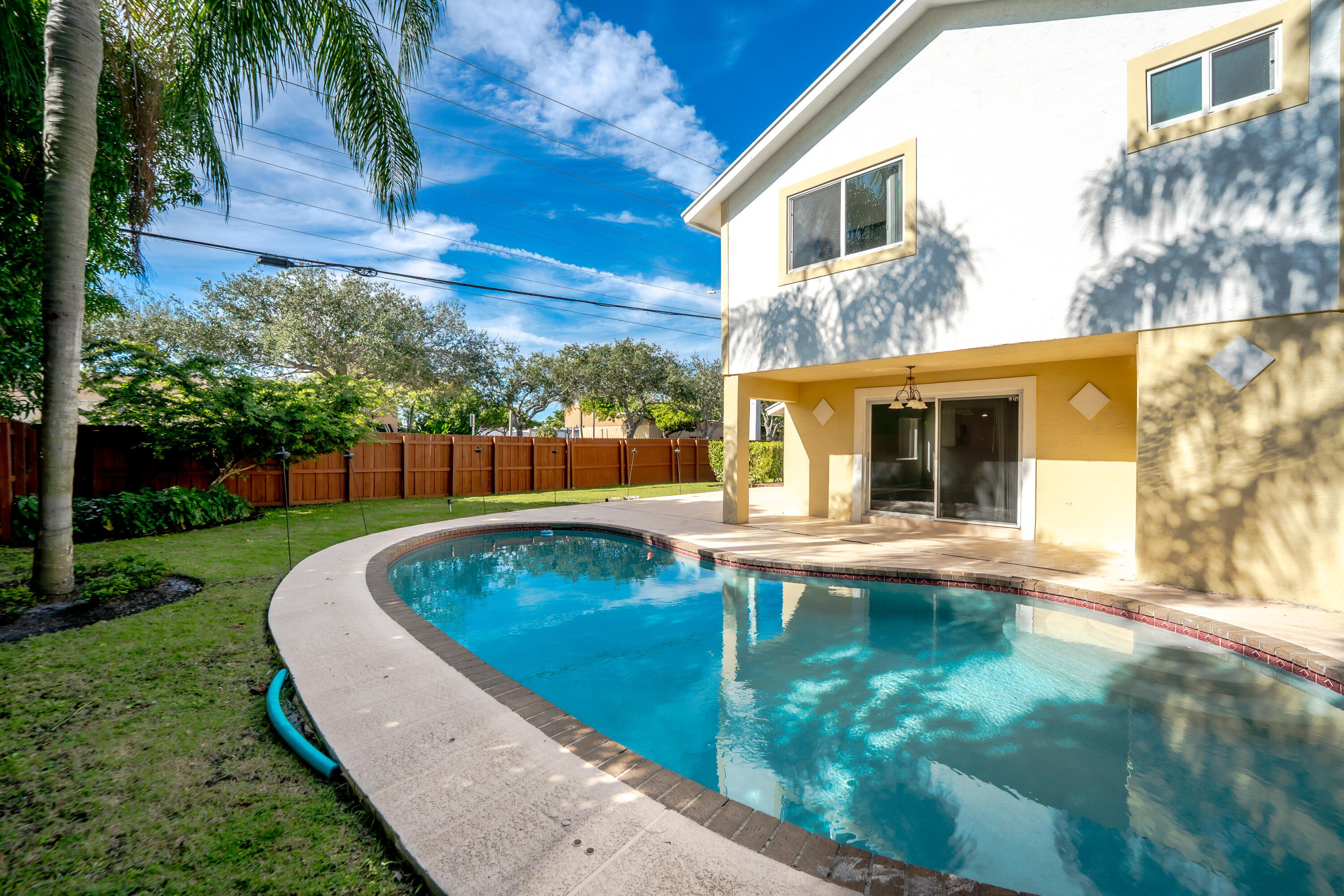 302 Northeast 36th Street Boca Raton, FL 33431 - Photo 2 of 40 a view of backyard with swimming pool