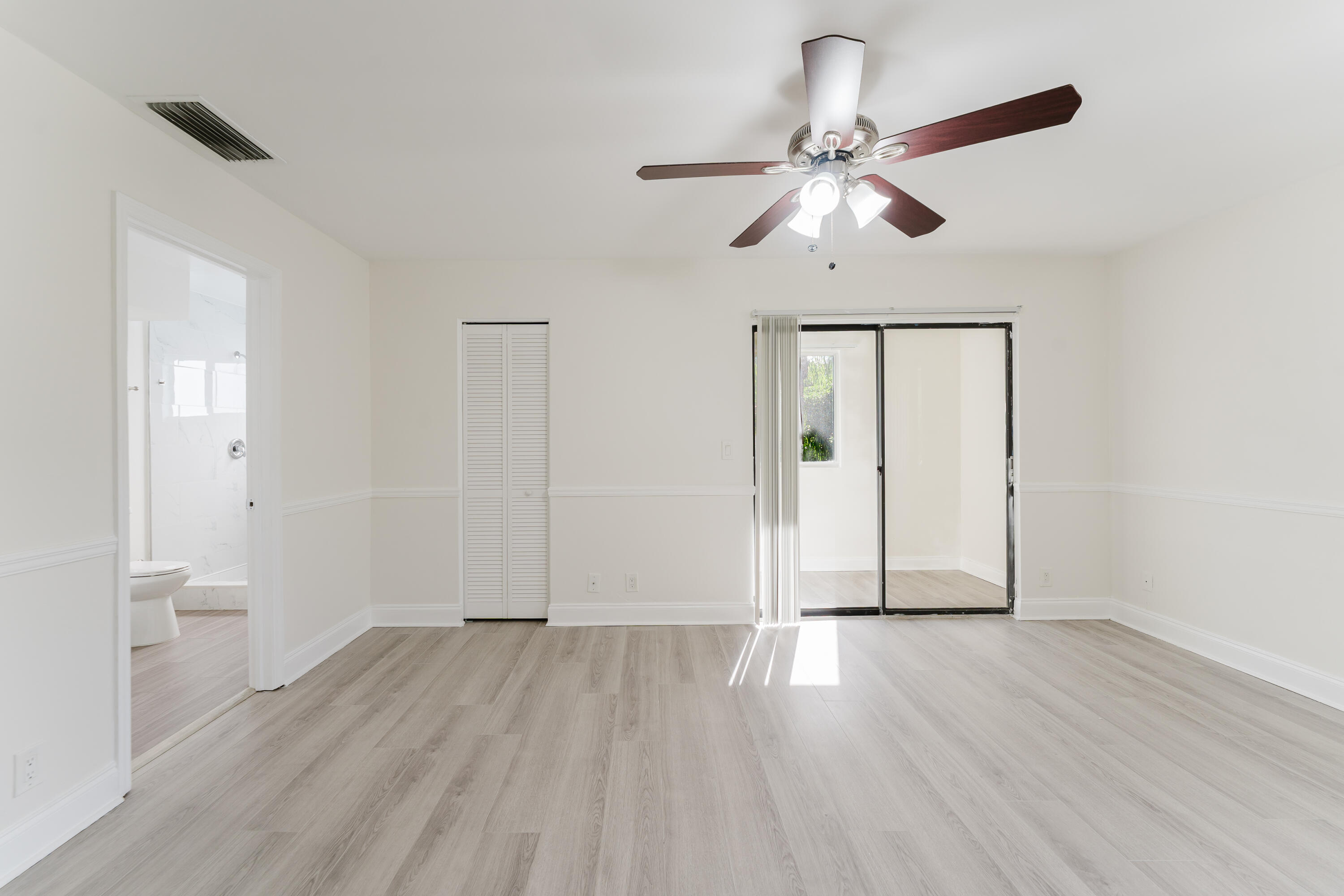 302 Northeast 36th Street Boca Raton, FL 33431 - Photo 28 of 40 a view of empty room with wooden floor