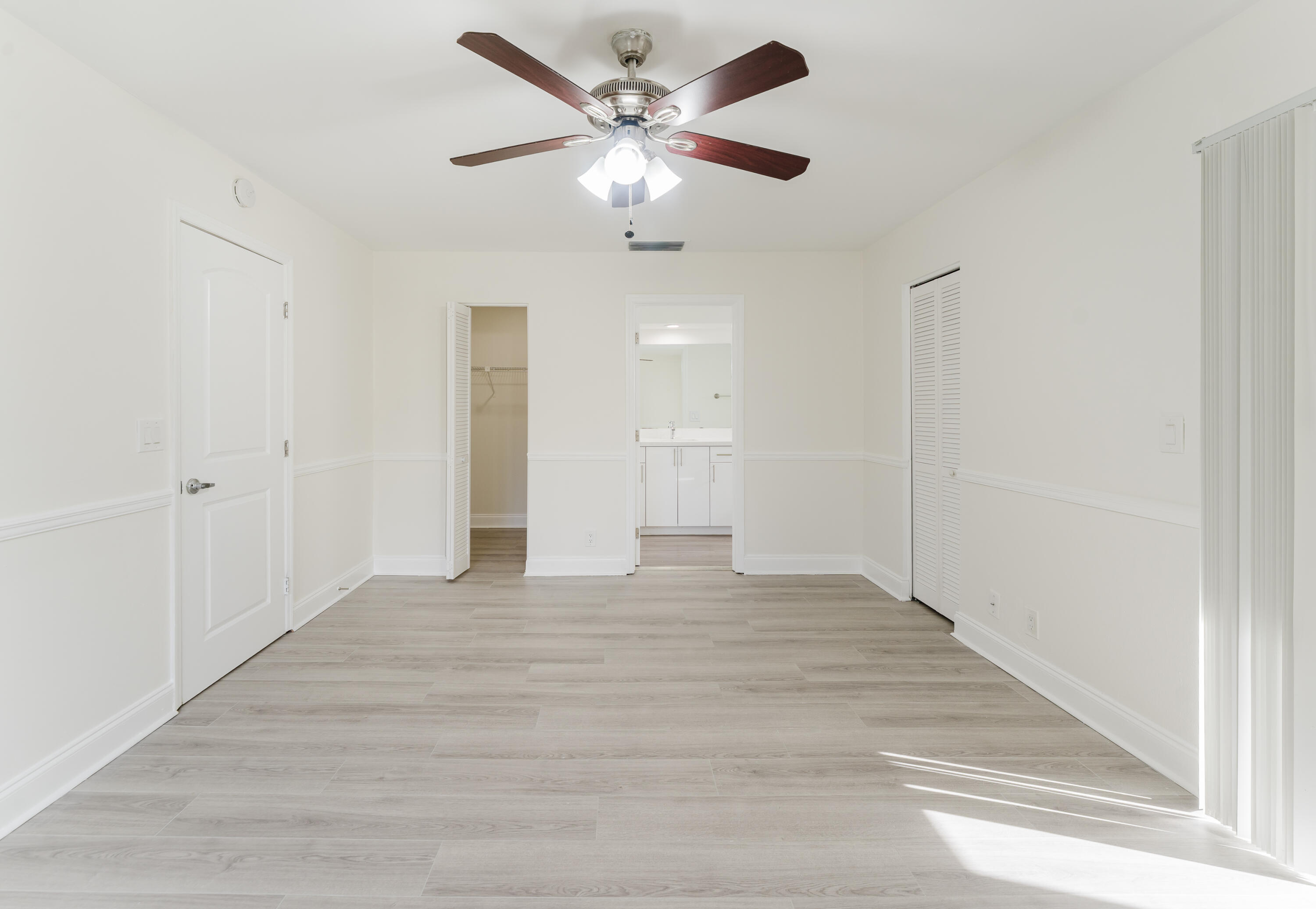 302 Northeast 36th Street Boca Raton, FL 33431 - Photo 30 of 40 a view of an empty room with a chandelier fan