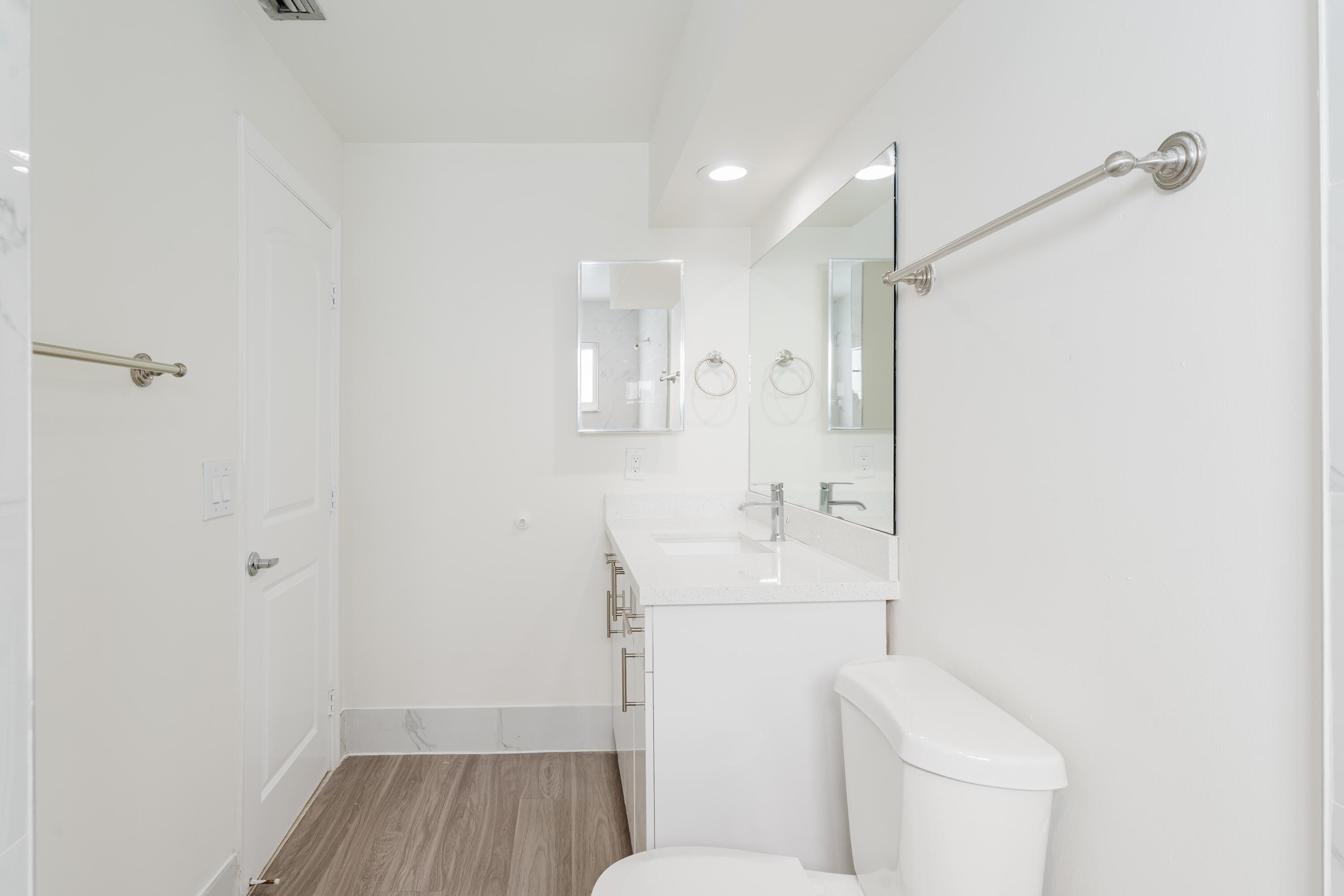 302 Northeast 36th Street Boca Raton, FL 33431 - Photo 34 of 40 a bathroom with a sink a toilet and shower