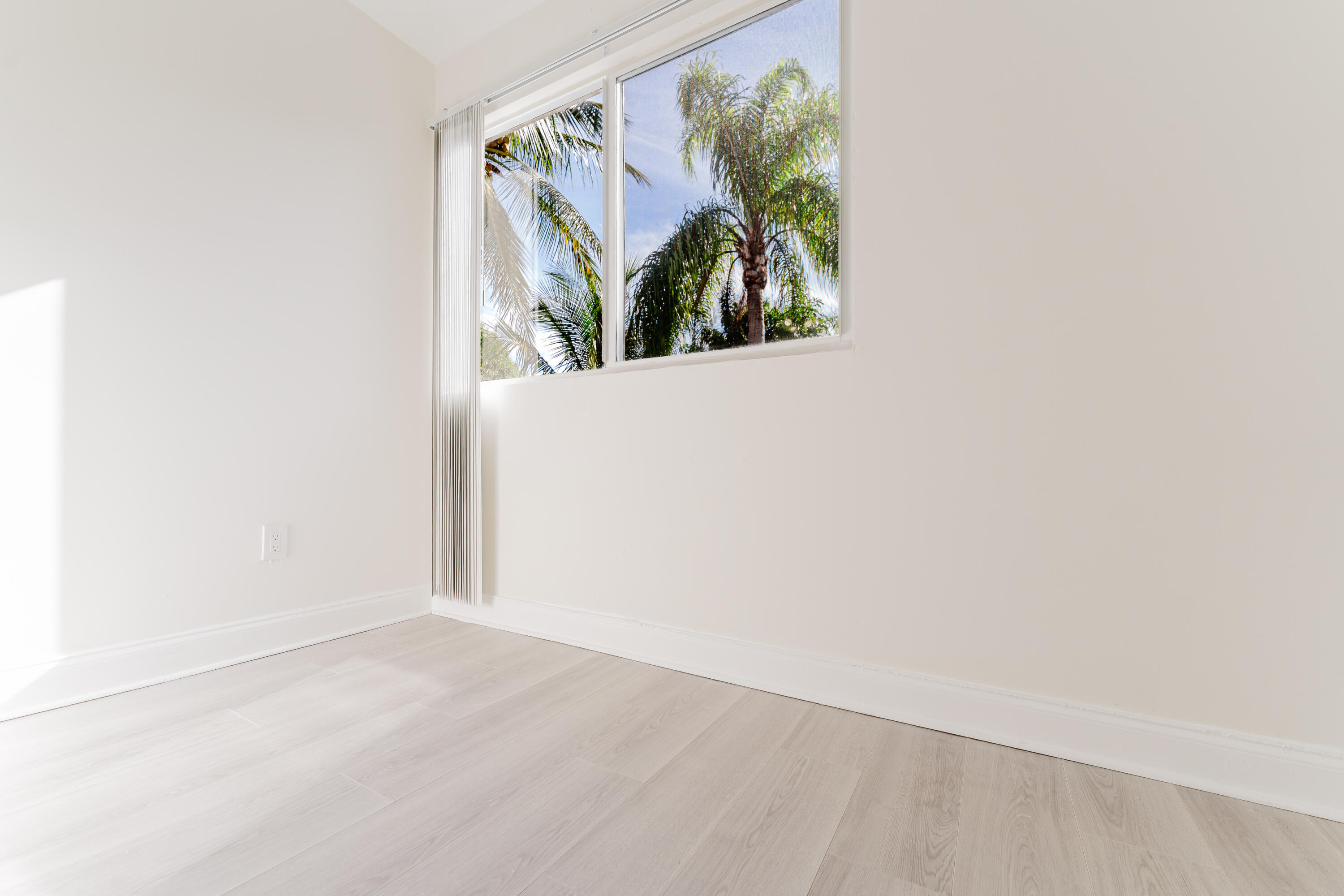 302 Northeast 36th Street Boca Raton, FL 33431 - Photo 35 of 40 a view of a small space with wooden floor and a window