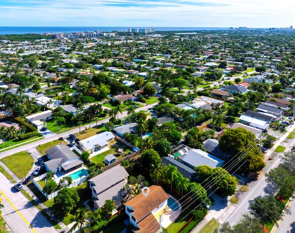 an aerial view of residential houses with outdoor space