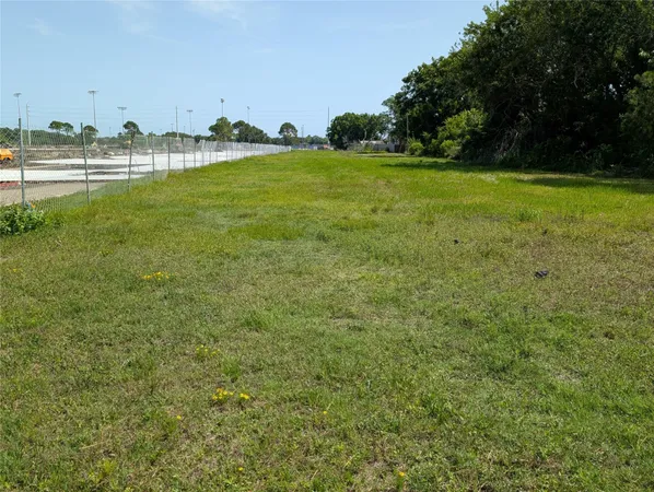 a view of a field with an trees