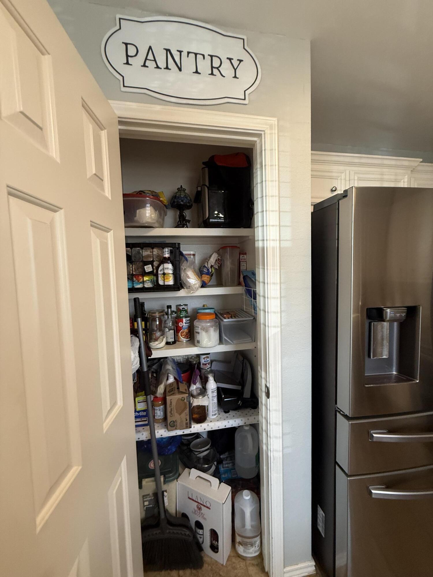 6906 8th Street Lubbock, TX 79416 - Photo 17 of 42 a view of a refrigerator in a kitchen