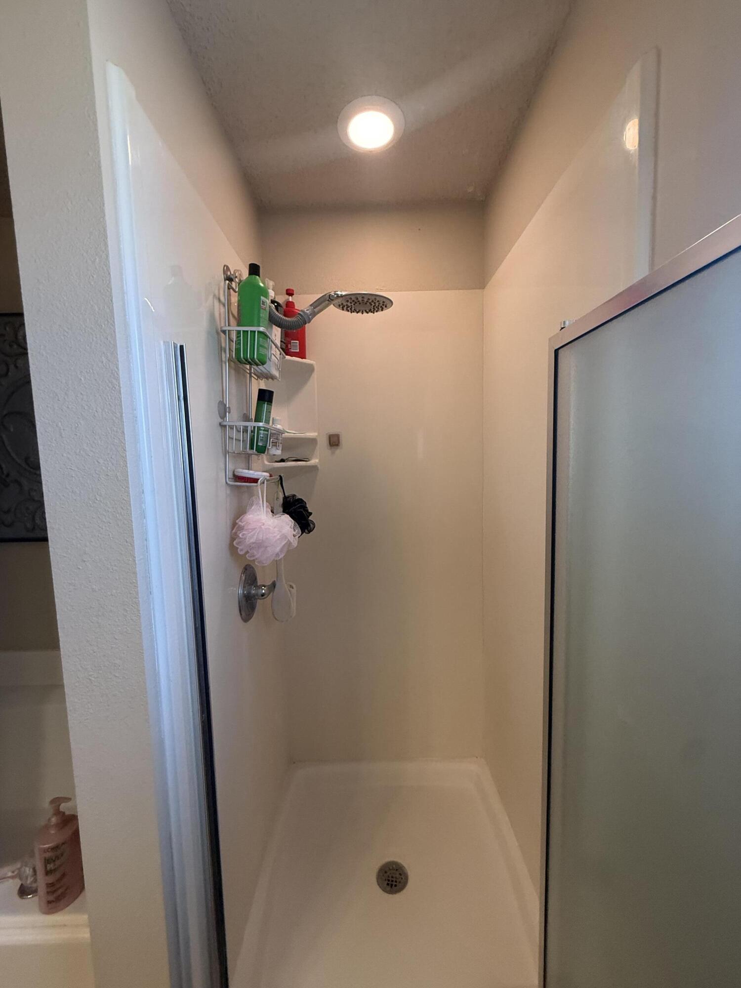 6906 8th Street Lubbock, TX 79416 - Photo 25 of 42 a bathroom with a shower