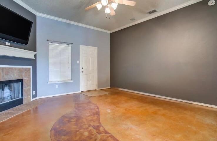 6906 8th Street Lubbock, TX 79416 - Photo 6 of 42 a view of an empty room with a fireplace