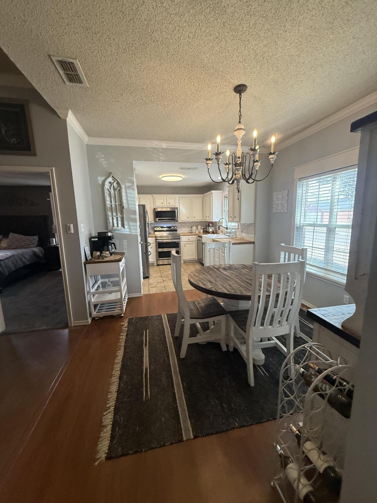 6906 8th Street Lubbock, TX 79416 - Photo 9 of 42 a dining room with furniture and window