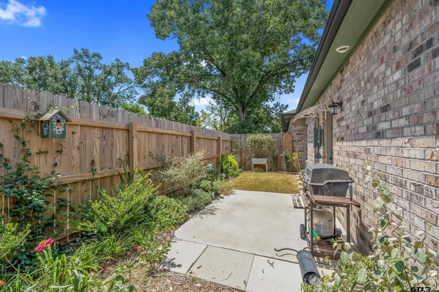 a view of a garden with patio