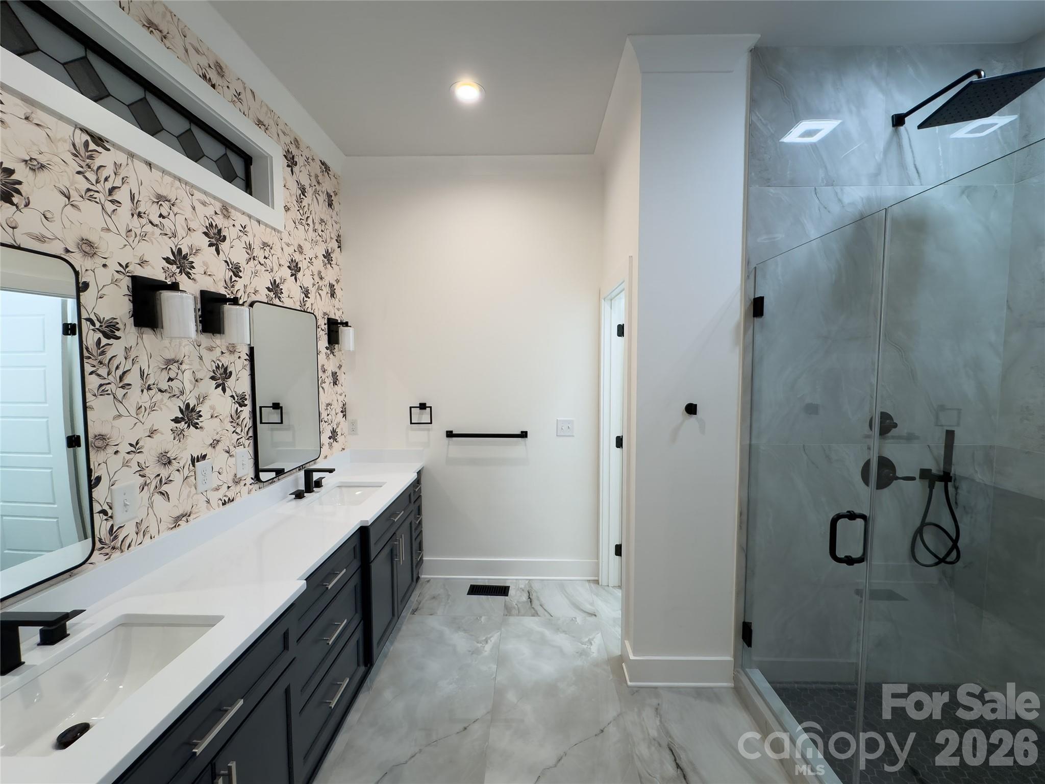 6265 Riviera Run Estates Drive Hickory, NC 28601 - Photo 19 of 44 a bathroom with a double vanity sink mirror and shower