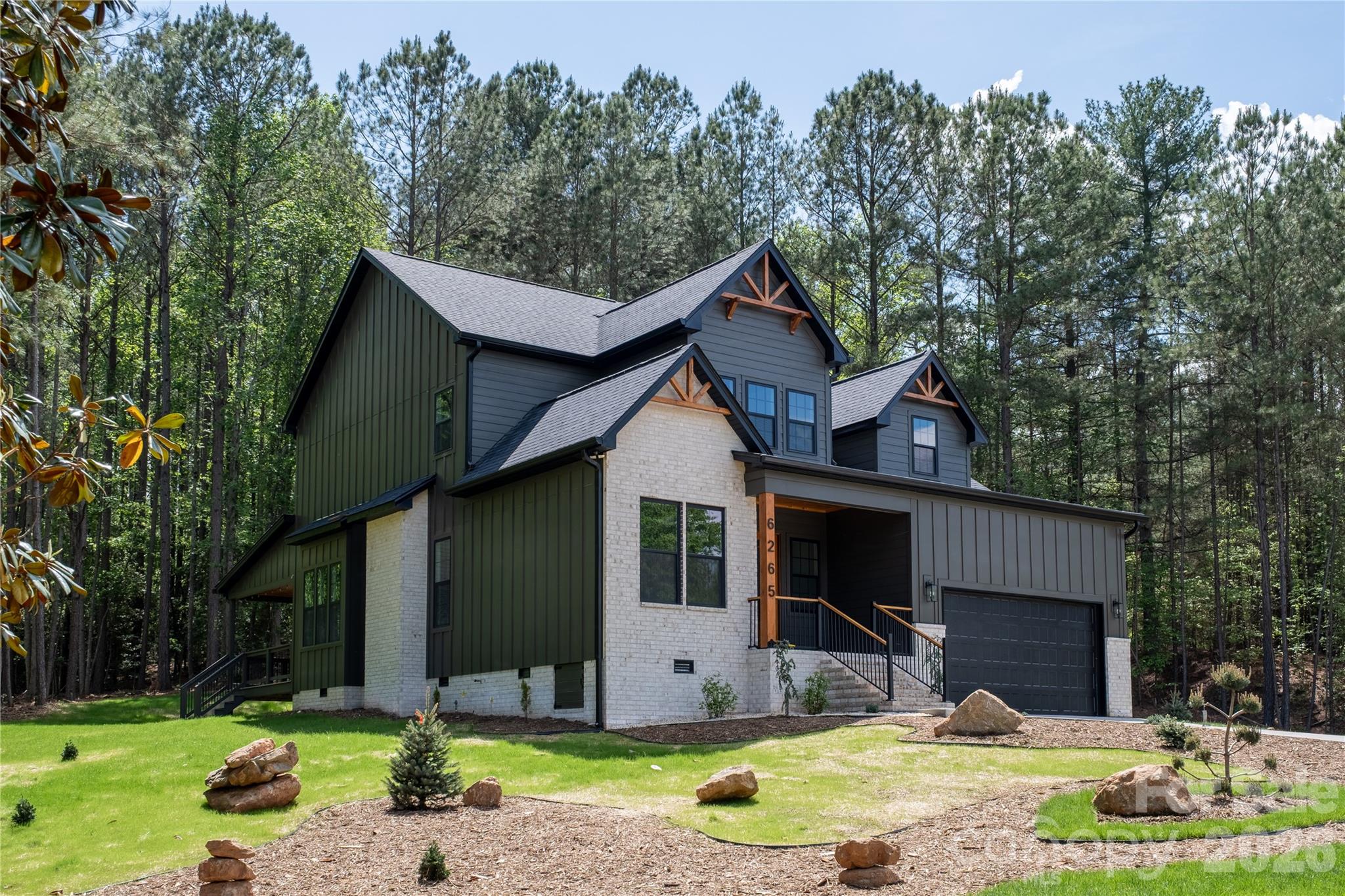 6265 Riviera Run Estates Drive Hickory, NC 28601 - Photo 2 of 44 a front view of a house with garden