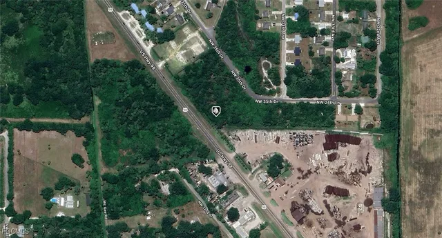 an aerial view of a house outdoor space and street view