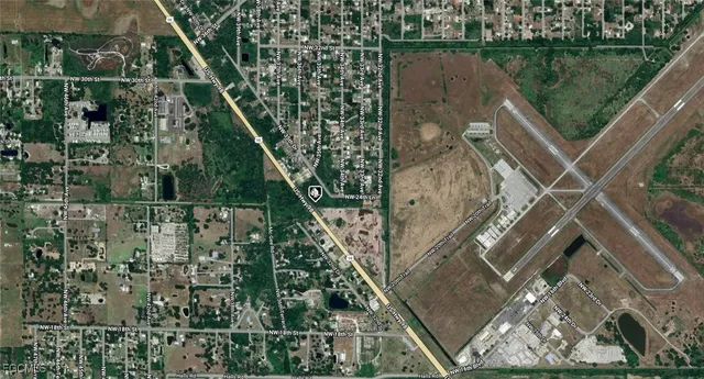 a aerial view of a house with a lake