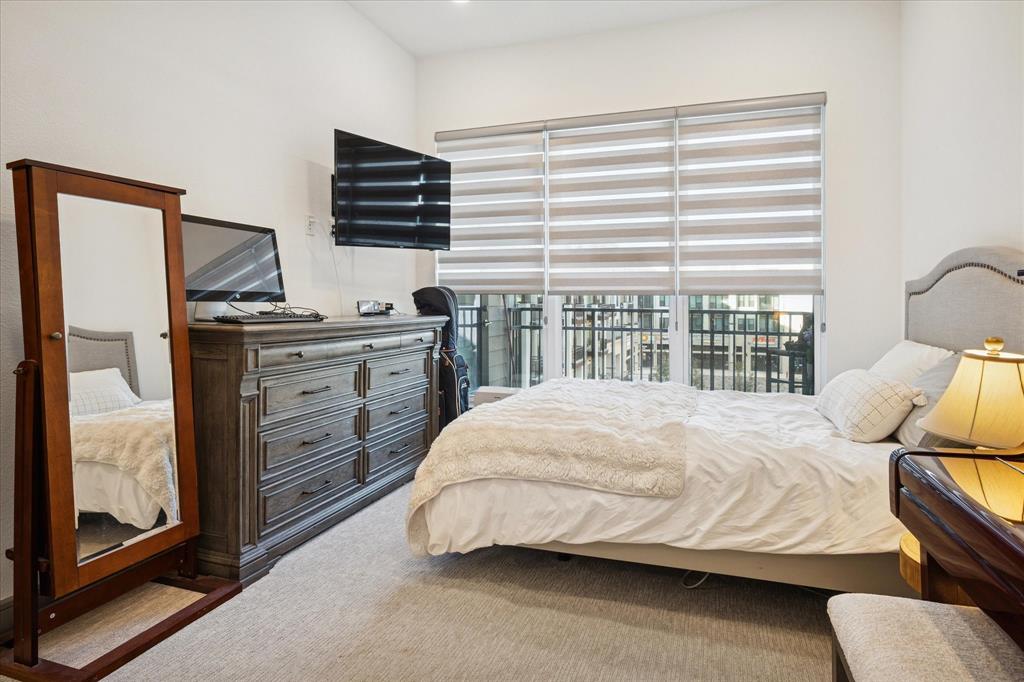 2700 Old Denton Road, Unit 3346 Carrollton, TX 75007 - Photo 12 of 21 a bedroom with a bed and furniture