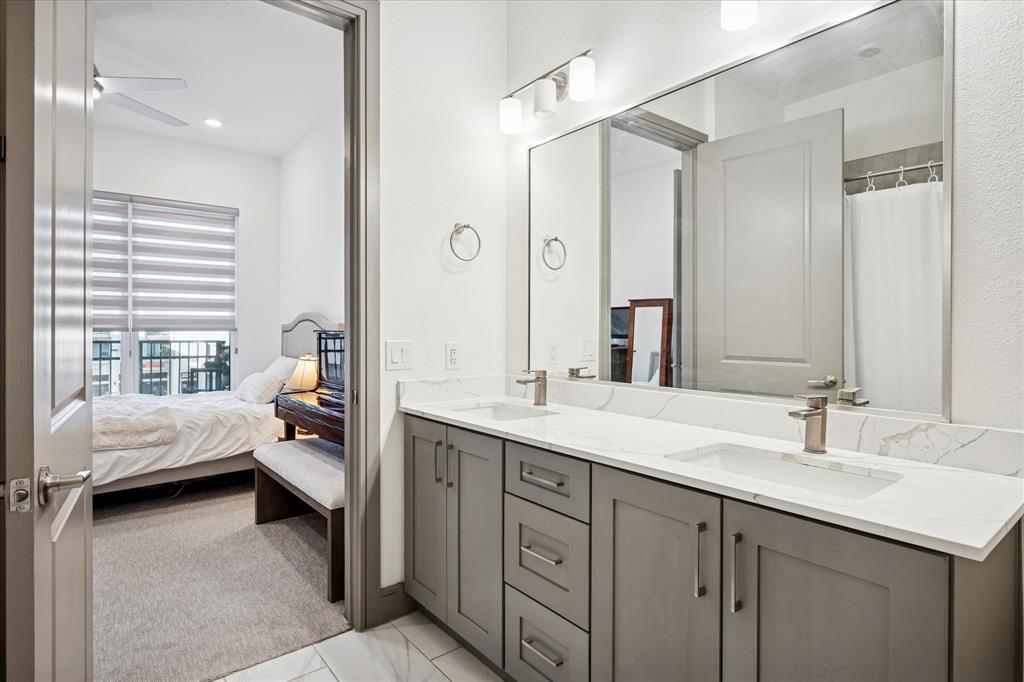 2700 Old Denton Road, Unit 3346 Carrollton, TX 75007 - Photo 14 of 21 a en suite bathroom with a double vanity sink mirror and