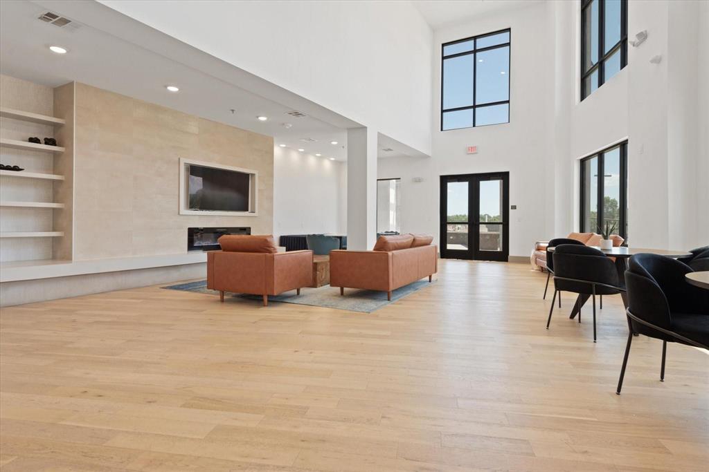 2700 Old Denton Road, Unit 3346 Carrollton, TX 75007 - Photo 18 of 21 a living room with furniture and a flat screen tv