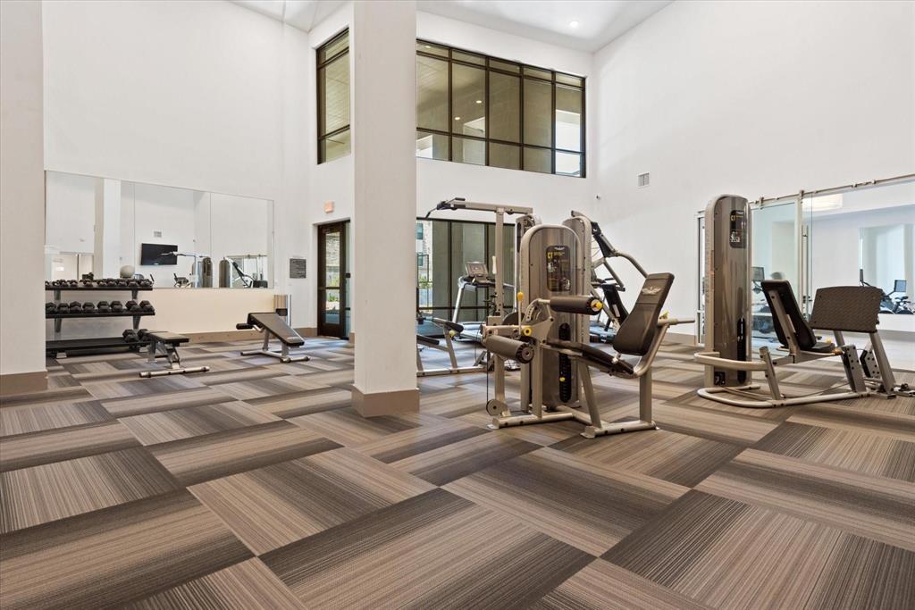 2700 Old Denton Road, Unit 3346 Carrollton, TX 75007 - Photo 20 of 21 a view of a living room filled with furniture and gym equipment
